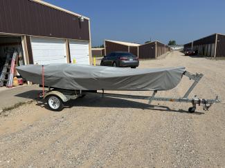 John Welsford Seagull Dory, on trailer, starboard side, covered