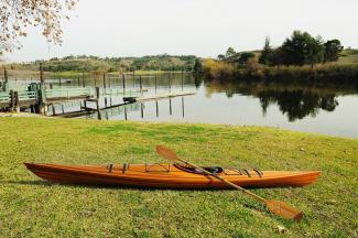 Wooden Kayak Miramichi 17'  - 1 person, port side view on grass