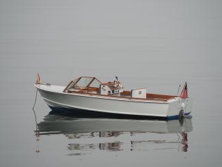 One of a Kind Runabout , in water port side view
