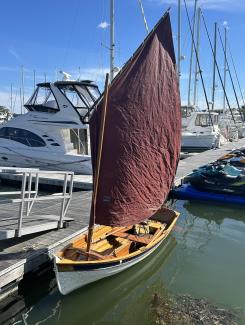 Penobscot 14, docked starboard side, sail up, view from bow port side