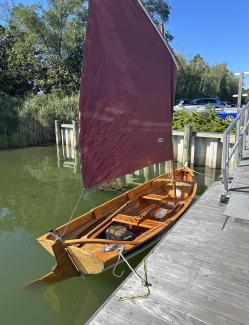Penobscot 14, docked starboard side, view from  stern end, sail up