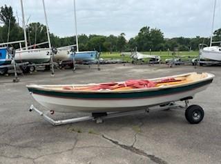 Shellback dinghy—a classic Joel White design, on trailer port side view