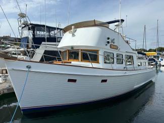 1969/1975 Monk Sr. Trawler, in water, docked port side bow view
