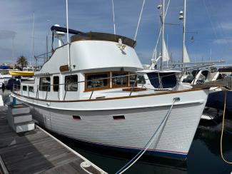 1969/1975 Monk Sr. Trawler, in water docked starboard side bow view