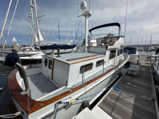 1969/1975 Monk Sr. Trawler, docked in water view stern starboard side