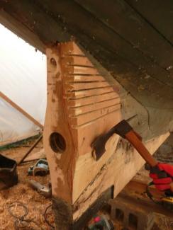 Josh Hermann, master shipwright, shaped the new black locust sternpost.