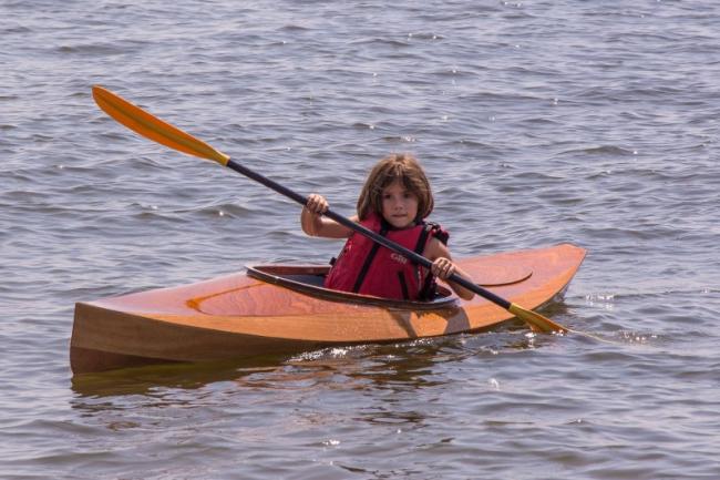 FLORA B., a Chesapeake Light Craft Wood Duckling kayak.