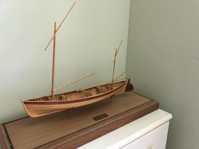 "Piccolo" 12' 8" Sailing Canoe and Model, on display port side view