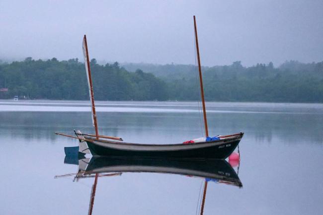2014 Oughtred Caledonia Yawl 19', in water reflecting in the  magical mystic