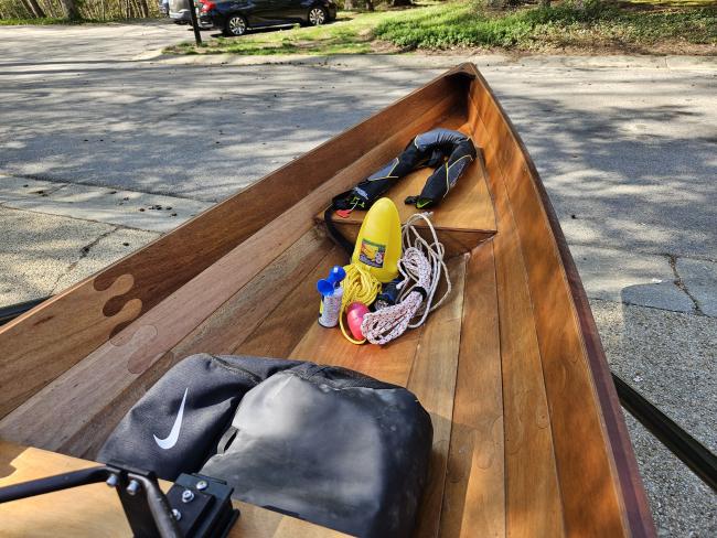 Annapolis Wherry Wooden Sliding Seat Row Boat, on stands upcose view inside