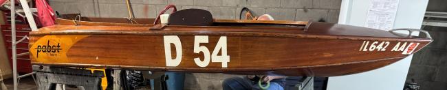 1950 Papst wooden racing boat, full starboard side view, indoors