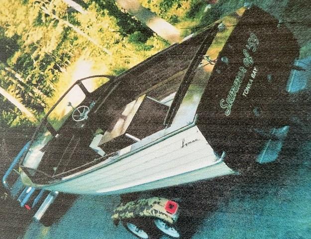 1959 23' Lyman Runabout, on trailer view of stern and port side