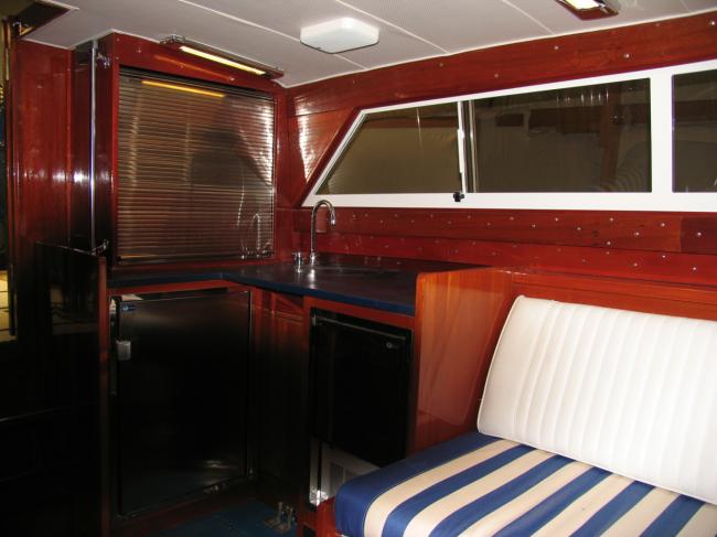 1963 Chris-Craft Futura 33', view inside kitchen area, sink, fridge