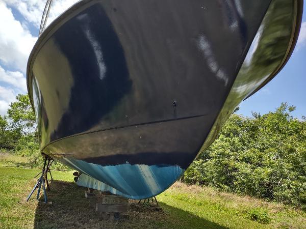 40' Lobster  Boat Custom Trawler, on stands on grass view of underneath
