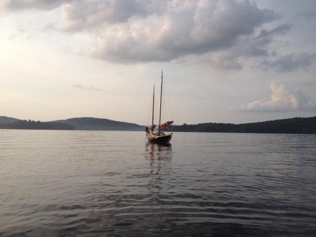 24' Peter van Dine Tancook Whaler, in water view from a distance clousdy looking at bow 