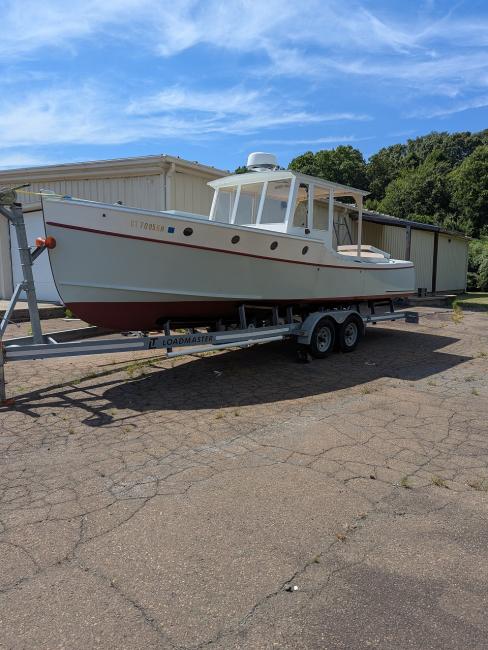 Doug  Hylan Bowler 26' 6" Power Cruiser , on trailer port side view