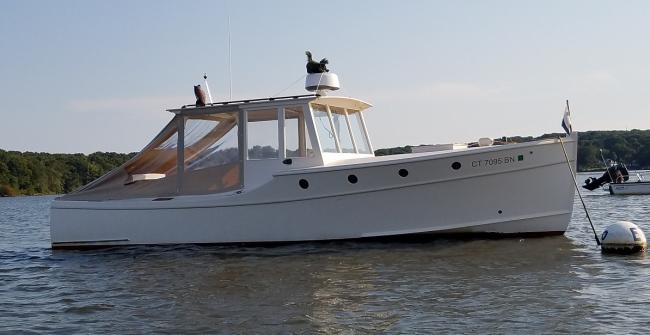 Doug  Hylan Bowler 26' 6" Power Cruiser , in water starboard side view