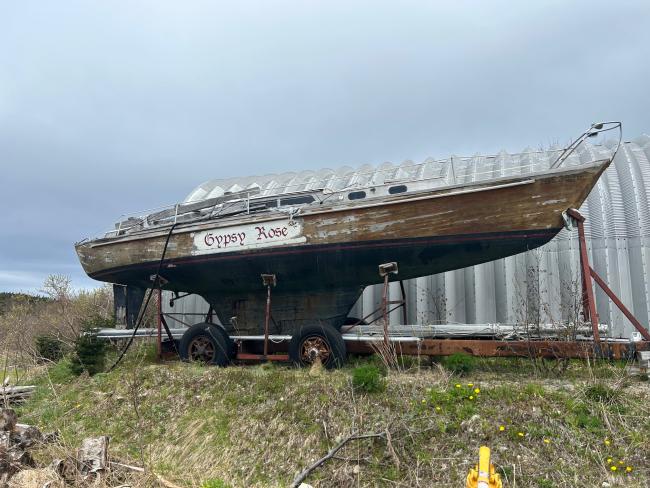 1964 Marconi-rigged 37' Wooden Sailboat, full long view, on the hard view of starboard side