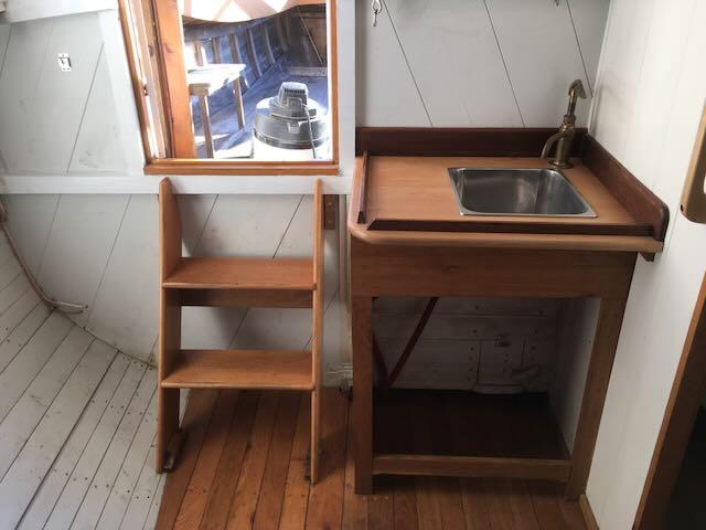 30' 1994 Bryan Motorsailer, view inside ladder and  sink area