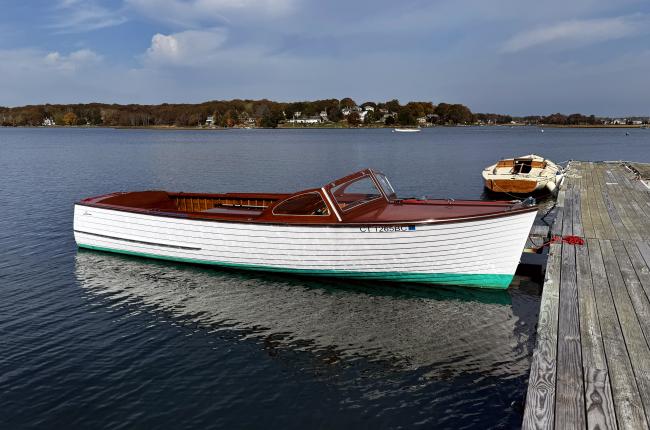 '57, 23' Lyman, runabout, docked starboard side view