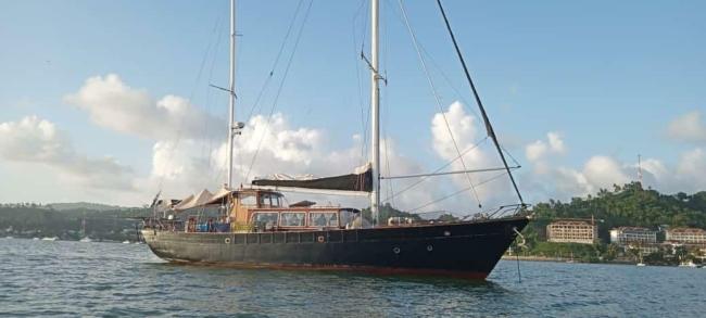 66' 1966 Custom 66 For Sale, in water starboard side bow view