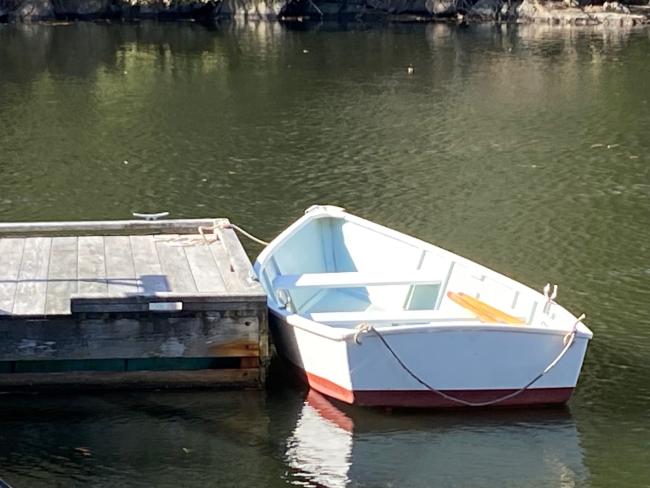12' wood skiff, docked port side stern end view