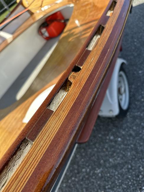 CLC Peeler Skiff 16, on trailer- up close view of side rail, port side