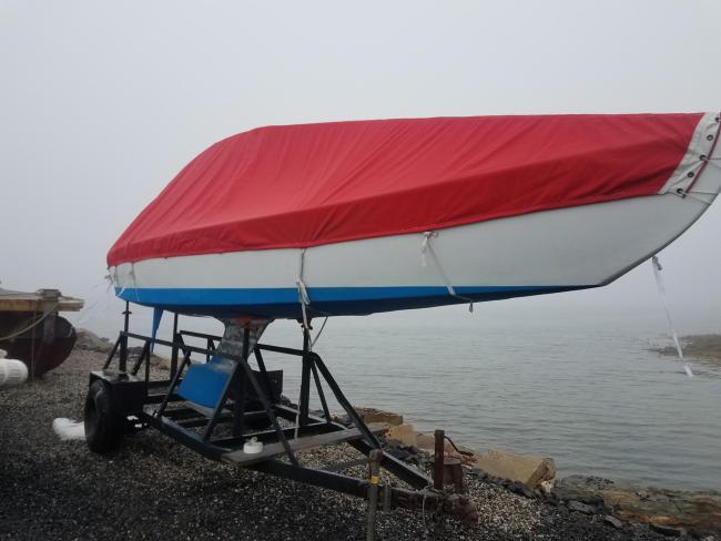 International 210 Hull No. 228 Restoration Complete, on land on stands starboard side view