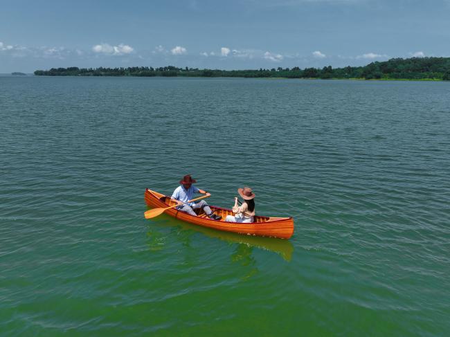 Wooden Canoe With Ribs Curved Bow 12', in water with people