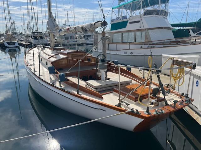 "MERRYWING" A 39' sloop, view of portside from stern, docked starboard side