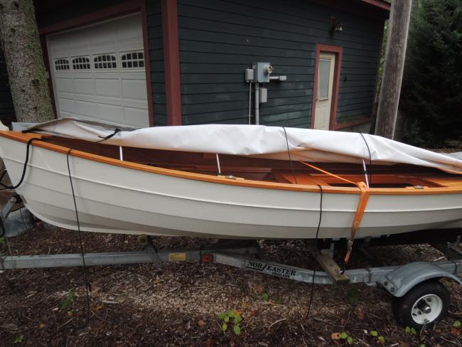 Penobscot 13 wooden sailboat, on trailer port side view