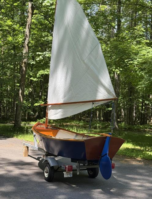 Sailing skiff, on trailer view of stern sail up port side