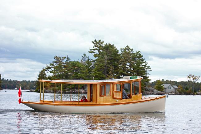 Sparks 30' electric/solar/diesel , in water full starboard side view