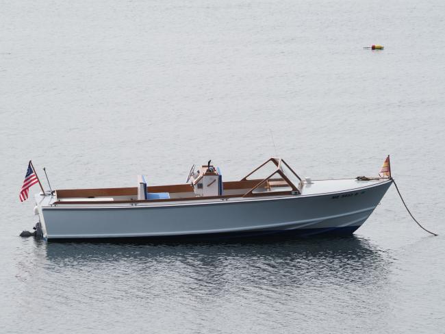 One of a Kind Runabout , in water starboard side view