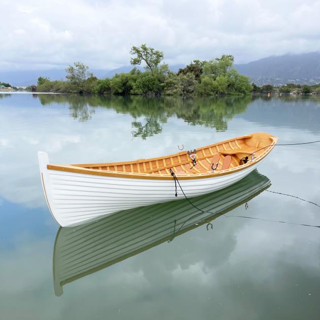 12 Ft Wooden Whitehall Rowboat with Gelcoat reinforcement, port side bow view in water