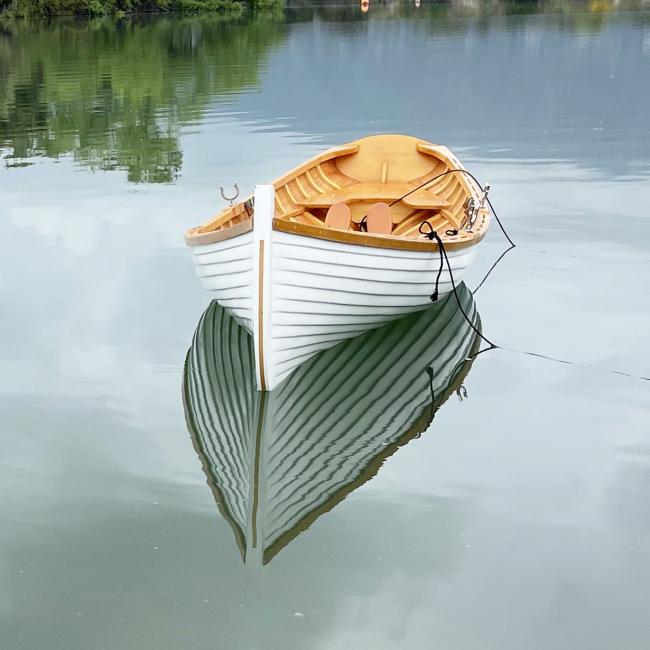 12 Ft Wooden Whitehall Rowboat with Gelcoat reinforcement, front bow view in water