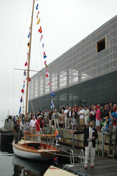 The community gathers in the marina for launch.