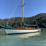 Freelance 38' wooden cutter, in water port side view