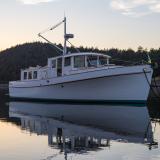 Stunning Pilot House Trawler, in water bow view starboard side