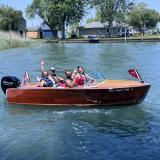 Classic 1956 Century Palomino Runabout 15', in water starboard side view