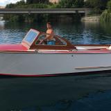 1956 Essaness Craft 23' classic wooden, in water port side view