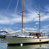 Pilothouse ketch, in water port side view