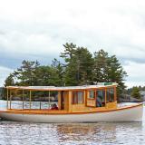 Sparks 30' electric/solar/diesel , in water full starboard side view