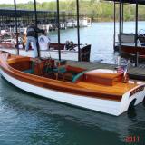 William Hand-like motor launch Custom-built mahogany, palope & cedar William Hand style motor launch, designed by Harry Bryan and owner, and powered by a 4 stoke Honda in stern cabinetry. The launch is on a galvanized, torsion bar suspended trailer with new tires.
