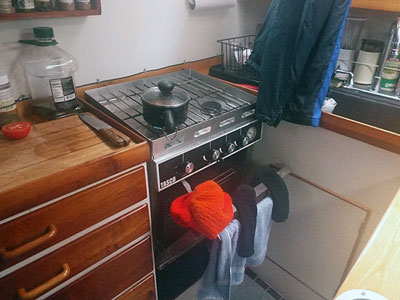 Using the oven for heat and drying out wet clothing.