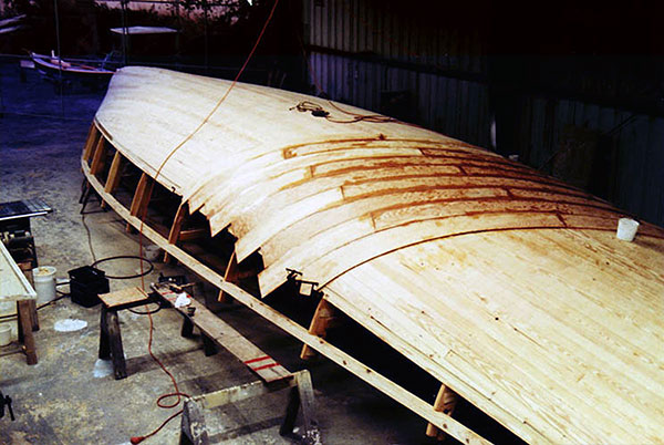 Plywood planking being laid.